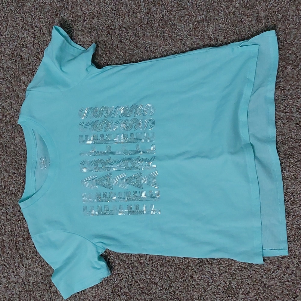 Light blue shirt with fearless written on it